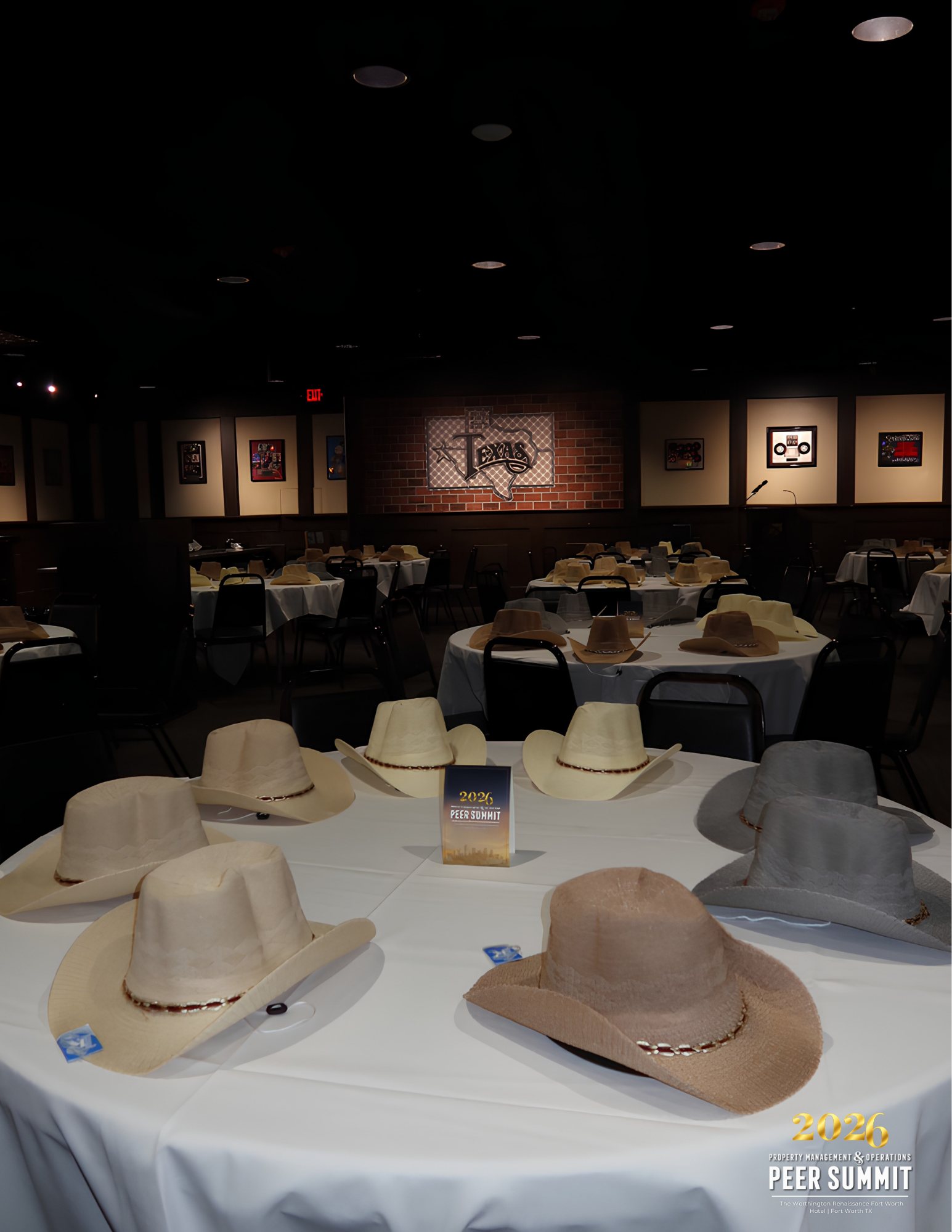 Cowboy hats set out on dinner tables at Billy Bob's Texas in the Fort Worth Stockyards for the Property Management & Operations Peer Summit.