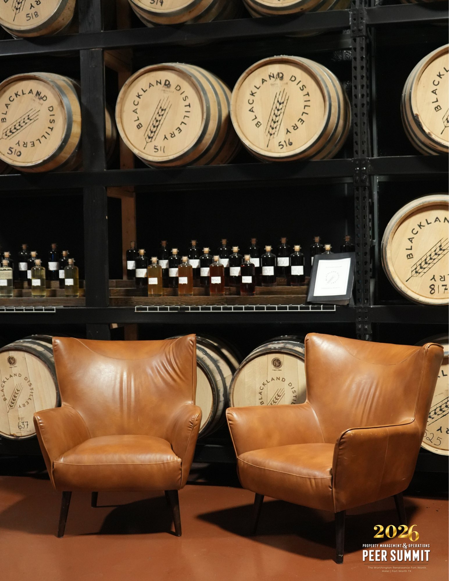 Leather lounge chairs in the barrel room at Blackland Distillery, Fort Worth, during a peer event planned by Modern Client.