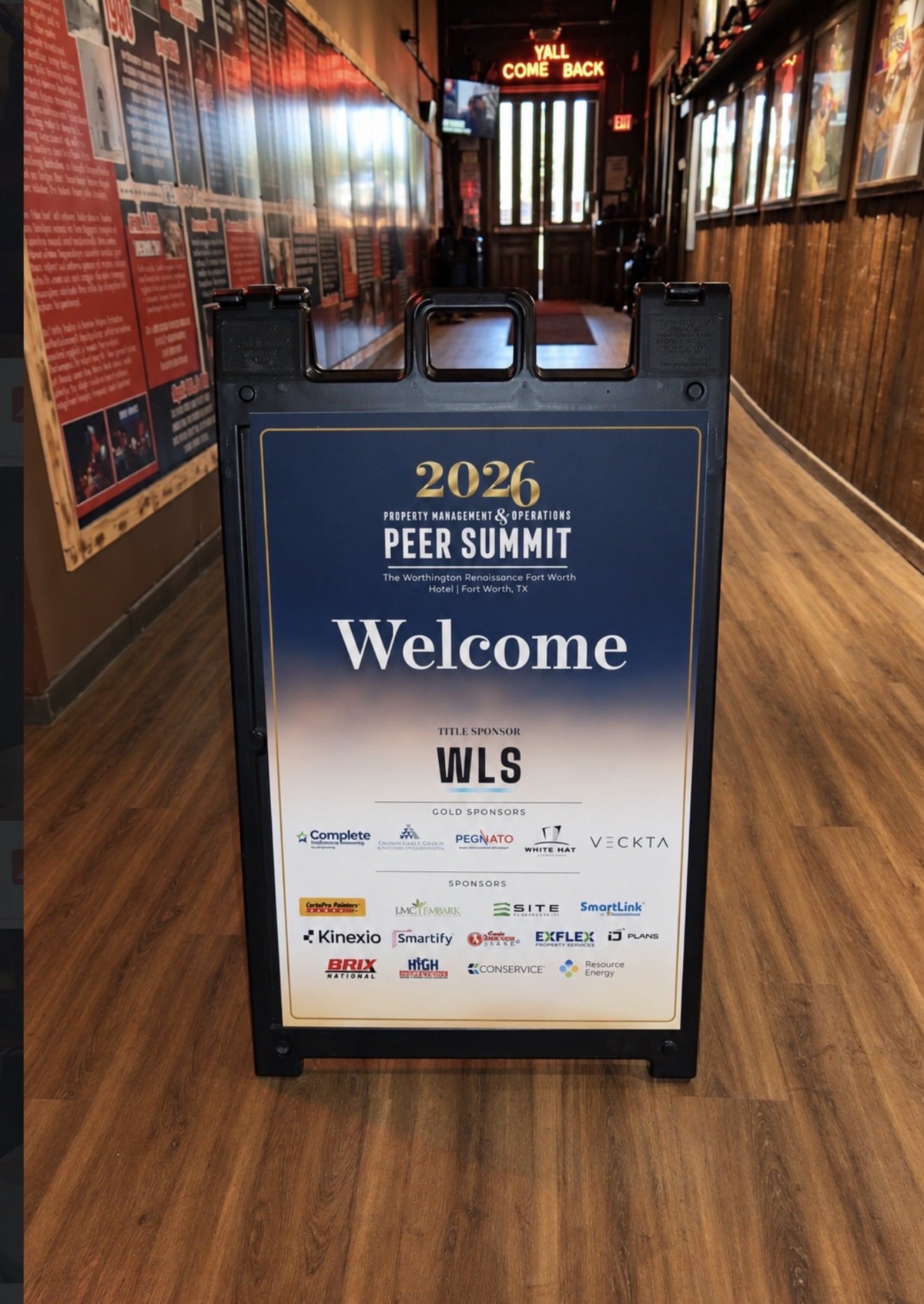 Welcome sign for the Property Management & Operations Peer Summit at The Worthington Renaissance Fort Worth Hotel.